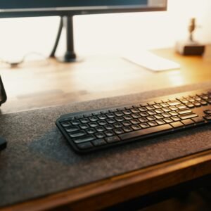 A well-lit desk featuring a smartphone and keyboard, ideal for productivity settings.